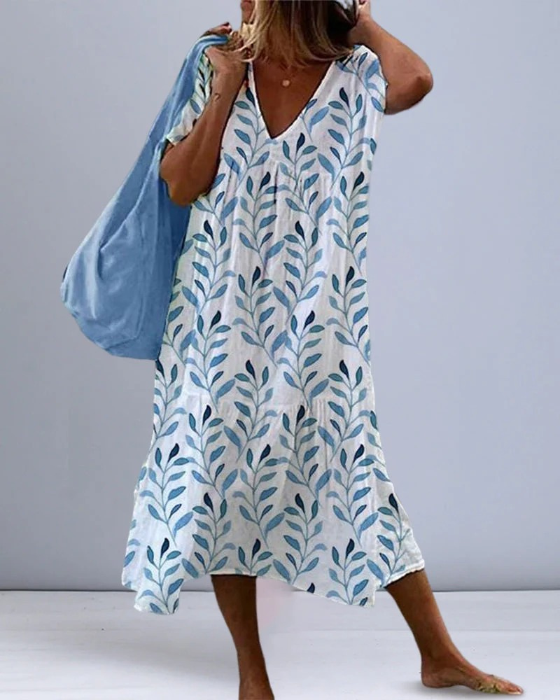 Robe d'été ample et respirante pour femme, longueur midi, parfaite pour les journées chaudes et les looks décontractés.